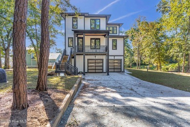 Experience elevated coastal living at 1624 Sunrise Lane in