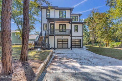 Experience elevated coastal living at 1624 Sunrise Lane in