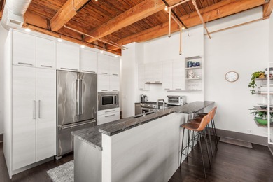 Exceptional brick-and-timber corner loft redesigned and