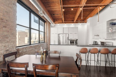 Exceptional brick-and-timber corner loft redesigned and