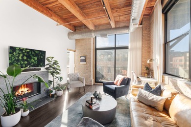 Exceptional brick-and-timber corner loft redesigned and