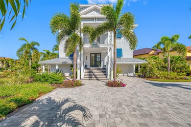 Welcome to this exceptional elevated Key West style 4-bedroom