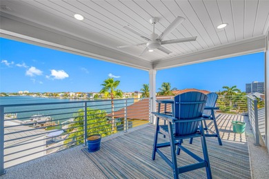 Welcome to this exceptional elevated Key West style 4-bedroom