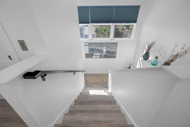 Welcome to this exceptional elevated Key West style 4-bedroom