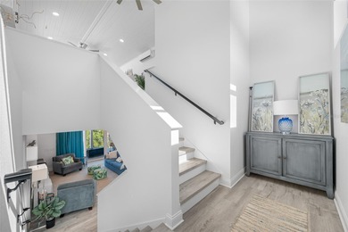 Welcome to this exceptional elevated Key West style 4-bedroom