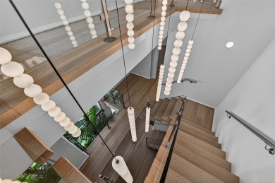 RARE OPPORTUNITY TO OWN A STUNNING 3-STORY MASTERPIECE ON THE