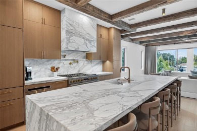 RARE OPPORTUNITY TO OWN A STUNNING 3-STORY MASTERPIECE ON THE