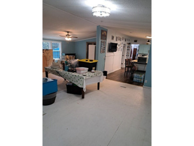 Located on 5 lovely cared for acres, this is a double wide