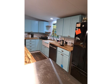 Located on 5 lovely cared for acres, this is a double wide