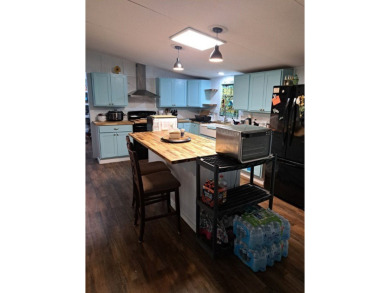 Located on 5 lovely cared for acres, this is a double wide