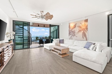 Enjoy sweeping south-facing views of the Palm Beach Inlet's