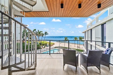 Enjoy sweeping south-facing views of the Palm Beach Inlet's