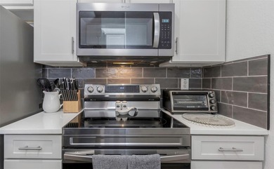 Stunning renovated end-unit condo is located next to the