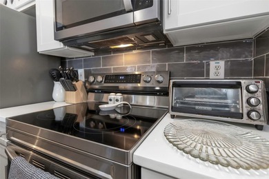 Stunning renovated end-unit condo is located next to the