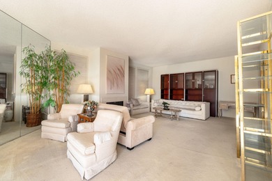 Perched above the shimmering lake and emerald fairways, 899