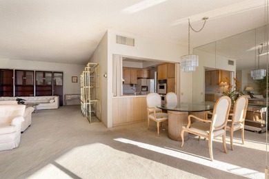 Perched above the shimmering lake and emerald fairways, 899