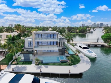 Set on a coveted point lot in the exclusive Harbor Beach enclave