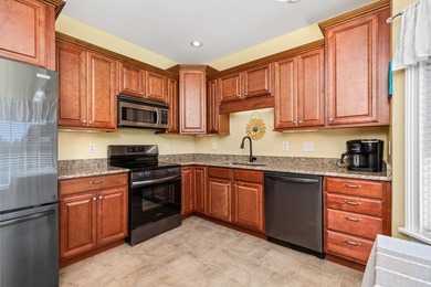 Embrace maintenance-free living in this beautiful end-unit