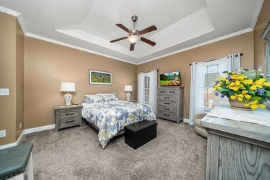 Embrace maintenance-free living in this beautiful end-unit