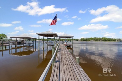 WATER FRONT LIVING DIRECTLY ON BON SECOUR RIVER! Custom built