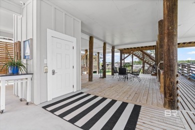 WATER FRONT LIVING DIRECTLY ON BON SECOUR RIVER! Custom built