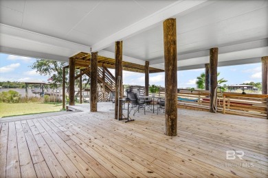 WATER FRONT LIVING DIRECTLY ON BON SECOUR RIVER! Custom built