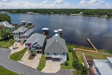 WATER FRONT LIVING DIRECTLY ON BON SECOUR RIVER! Custom built