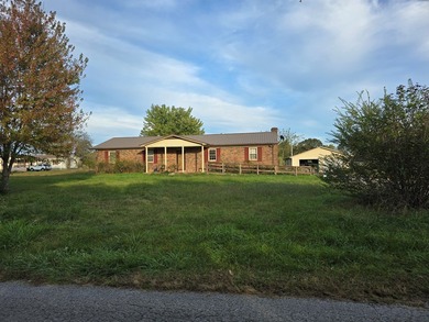 Bring your imagination! This 4-bedroom, 1.5-bath brick home is