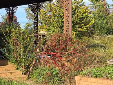 Bring your imagination! This 4-bedroom, 1.5-bath brick home is