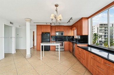 Welcome to this exceptional 2-bedroom, 2-bath condo perched on