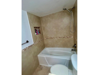 Don't miss This beautifully updated 2/2 penthouse condo