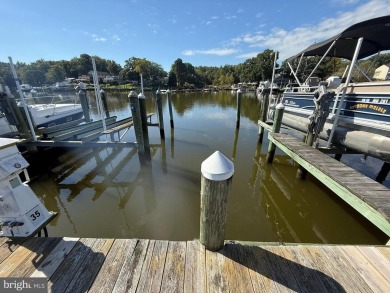 Includes a separately deeded BOAT SLIP  Welcome home to this