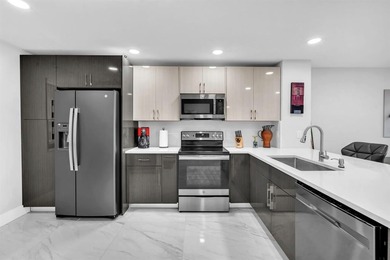 Impeccably renovated corner condo showcasing exceptional luxury