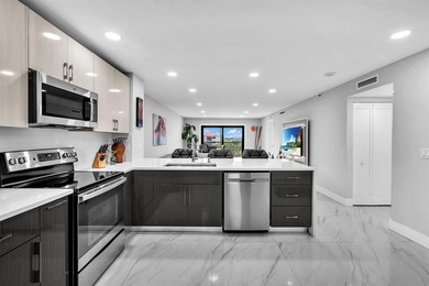 Impeccably renovated corner condo showcasing exceptional luxury