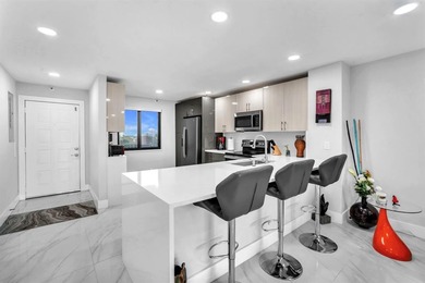 Impeccably renovated corner condo showcasing exceptional luxury