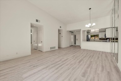 Located in the iconic Rose Garden community in central Palm