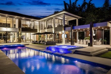 This luxury masterpiece estate, set on nearly one acre, features