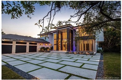 This luxury masterpiece estate, set on nearly one acre, features