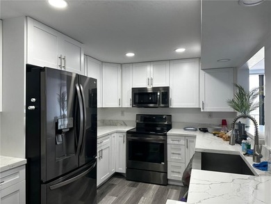 Move right into this immaculate, totally updated 2bd/2bth condo