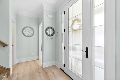 This gorgeous home in Kure Beach Village has 5 bedrooms, 5 1/2