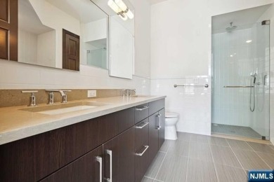 Experience luxury waterfront living in this stunning 2-bedroom