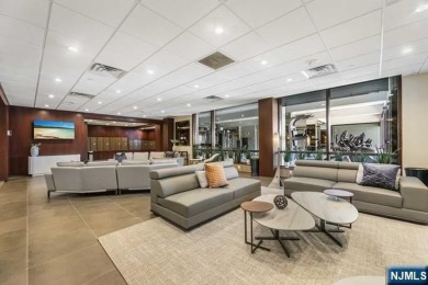 Experience luxury waterfront living in this stunning 2-bedroom