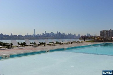 Experience luxury waterfront living in this stunning 2-bedroom