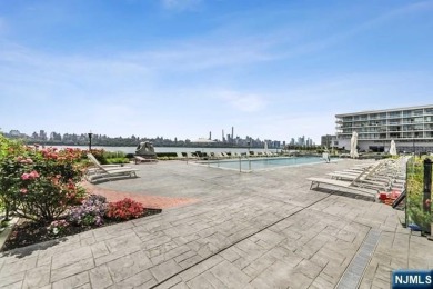 Experience luxury waterfront living in this stunning 2-bedroom