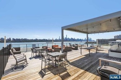 Experience luxury waterfront living in this stunning 2-bedroom