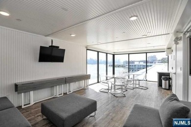 Experience luxury waterfront living in this stunning 2-bedroom