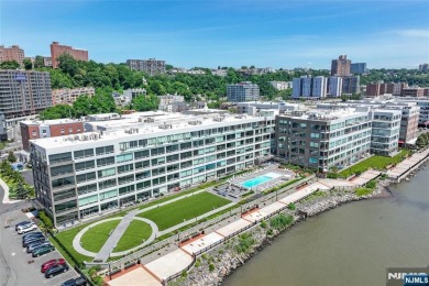 Experience luxury waterfront living in this stunning 2-bedroom