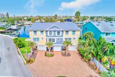 Stunning waterfront townhome just steps from the beach! Built in
