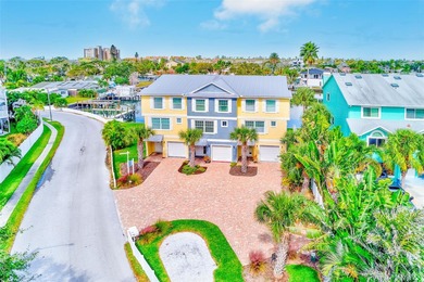 Stunning waterfront townhome just steps from the beach! Built in