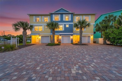 Stunning waterfront townhome just steps from the beach! Built in